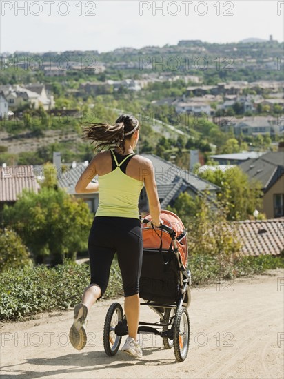 Woman jogging with stroller