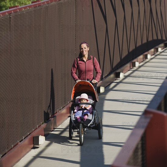 Woman jogging with stroller