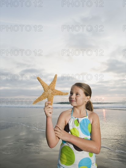 Girl holding starfish