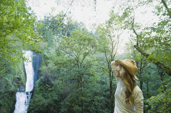 Hiker looking at waterfall