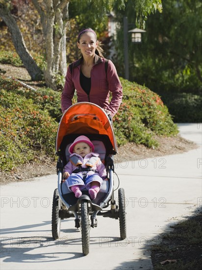 Woman jogging with stroller