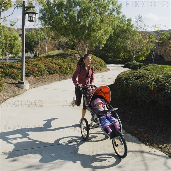 Woman jogging with stroller