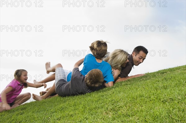 Family playing on grass