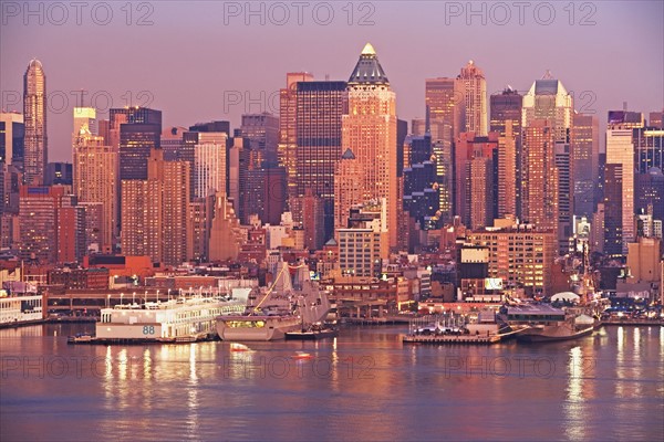 Waterfront buildings at sunset