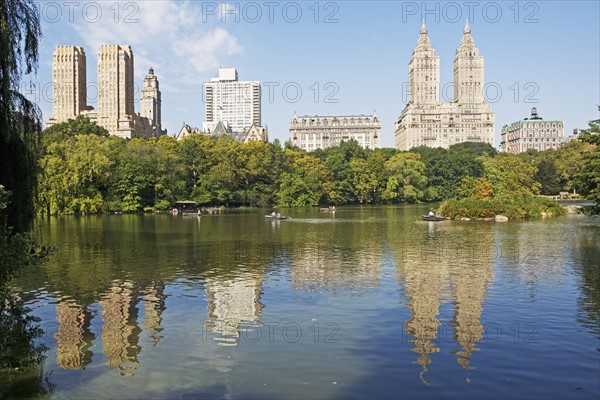 Cityscape reflected in lake