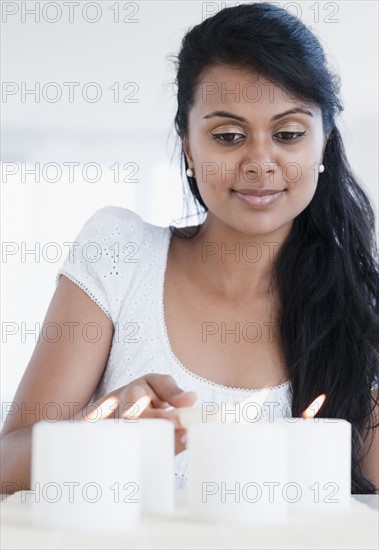 Woman lighting candles