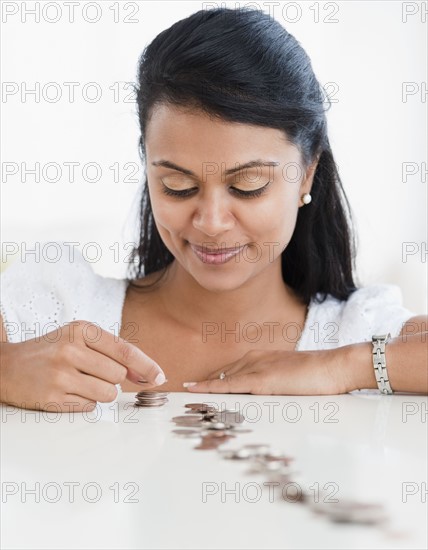 Woman stacking coins