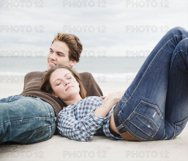 Couple resting on beach