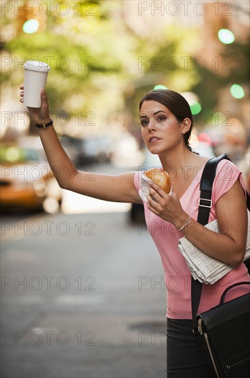 Woman hailing cab