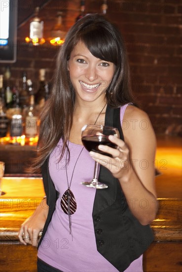 Woman drinking wine.