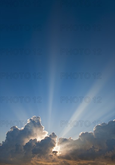 Sunset behind clouds.