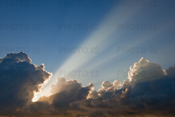 Sunset behind clouds.