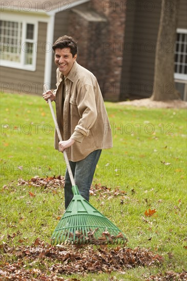 Man raking leaves.