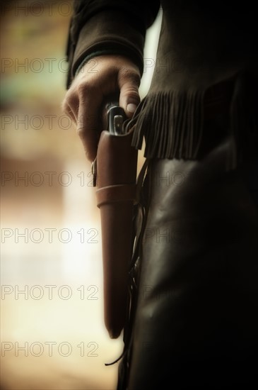 Cowboy with gun in holster.