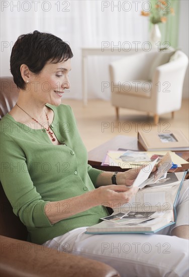 Woman looking at photographs.