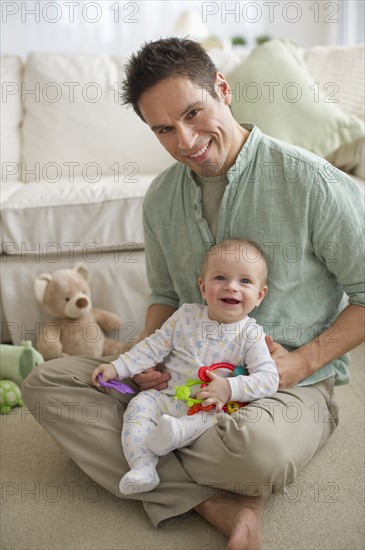 Father sitting with baby.