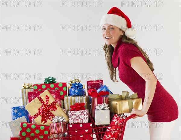 Shopping cart full of Christmas presents.