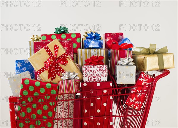 Shopping cart full of Christmas presents.