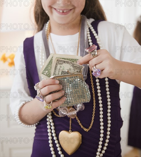 Young girl playing dress-up. Photographer: Jamie Grill