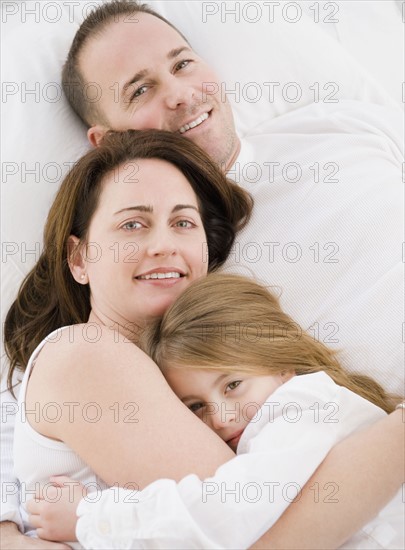 Family cuddling. Photographer: Jamie Grill