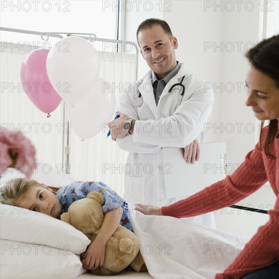 Young girl in hospital bed. Photographer: Jamie Grill