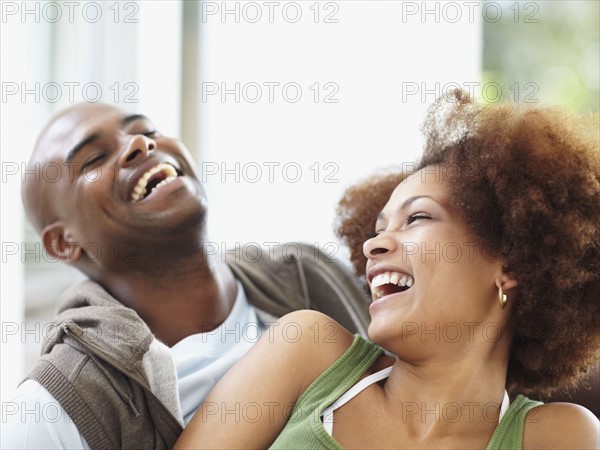 Couple laughing. Photographer: momentimages