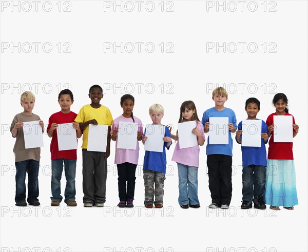 Children holding paper. Photographer: momentimages