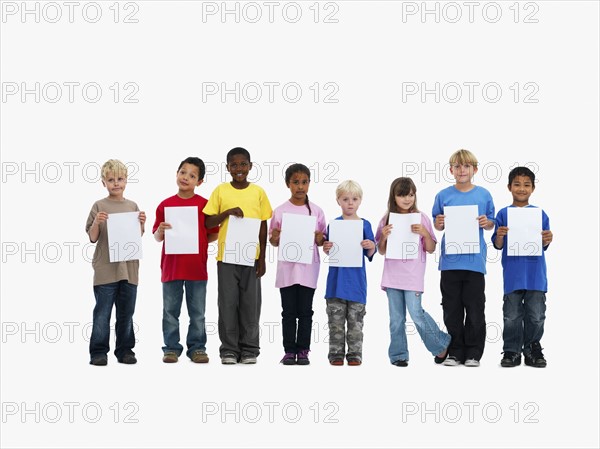 Children holding paper. Photographer: momentimages