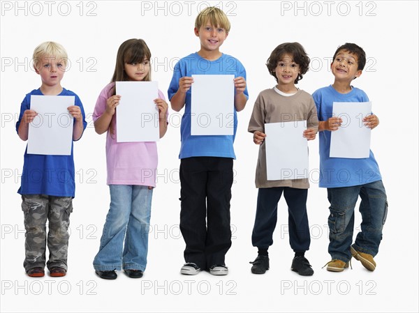 Children holding paper. Photographer: momentimages