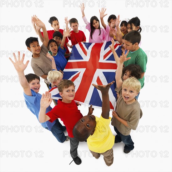 Children holding flag. Photographer: momentimages