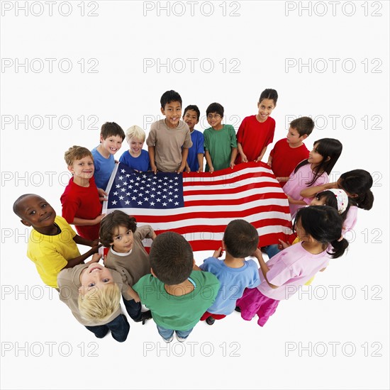 Children holding flag. Photographer: momentimages