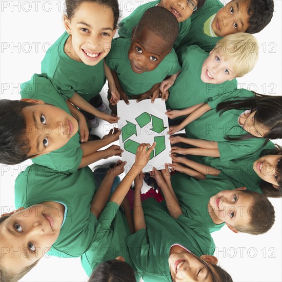 Children holding recycle sign. Photographer: momentimages