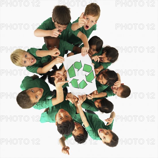 Children holding recycle sign. Photographer: momentimages