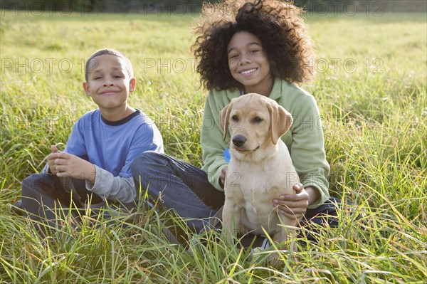 Children and dog. Photographer: Pauline St.Denis