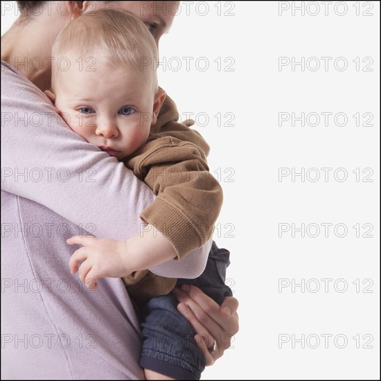 Mother and son embrace. Photographer: Mike Kemp