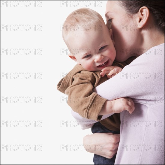 Mother and son embrace. Photographer: Mike Kemp