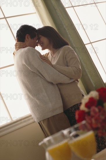 Couple embracing. Photographer: Rob Lewine