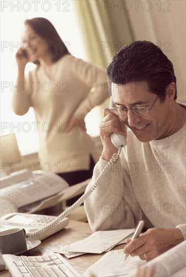 Couple working in home office. Photographer: Rob Lewine