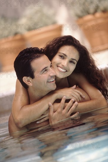 Couple in a pool. Photographer: Rob Lewine