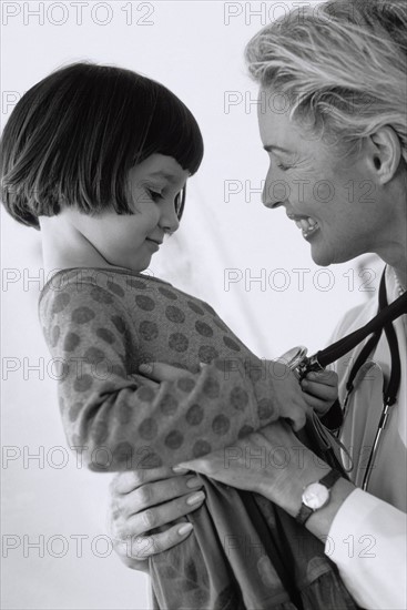 Child having check-up at doctor's office. Photographer: Rob Lewine