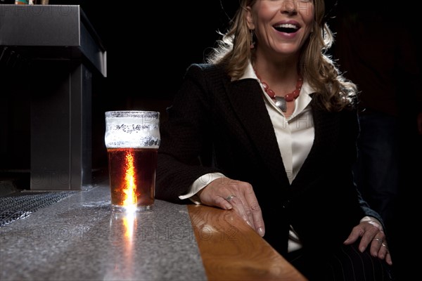 Woman at bar. Photographer: Dan Bannister