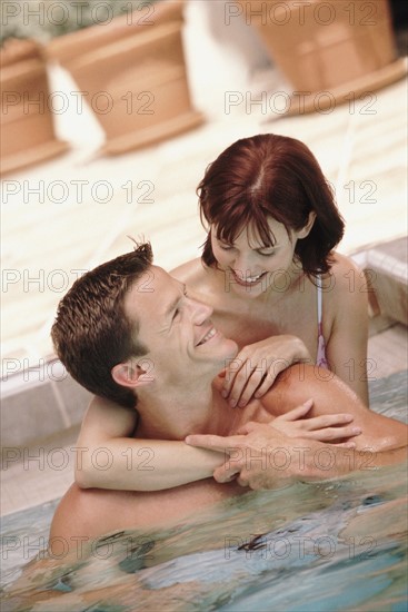 Couple in pool. Photographer: Rob Lewine