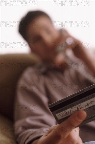 Man making credit card purchase. Photographer: Rob Lewine