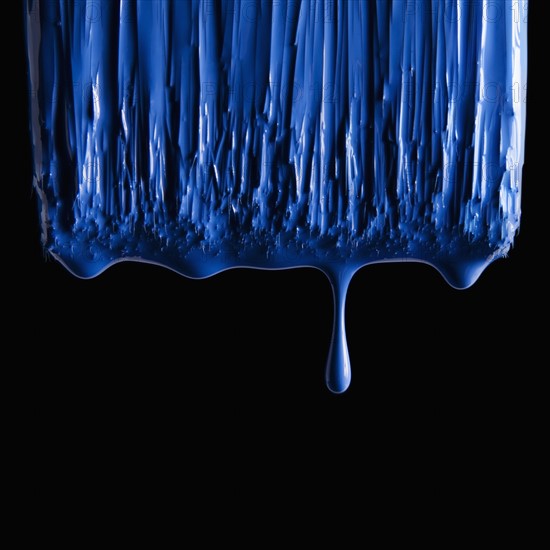 Paint brush and blue paint. Photographer: Mike Kemp