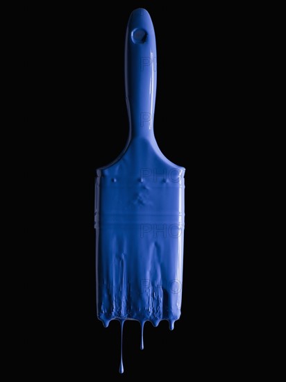 Paint brush and blue paint. Photographer: Mike Kemp