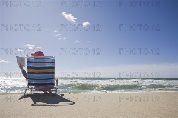 Reading at the beach. Photographer: Chris Hackett