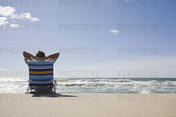 Relaxing on the beach. Photographer: Chris Hackett