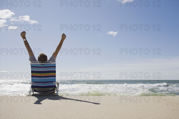Relaxing on the beach. Photographer: Chris Hackett