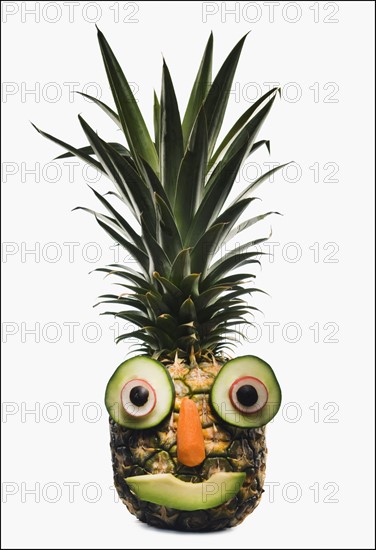 Pineapple with a happy face. Photographer: Mike Kemp