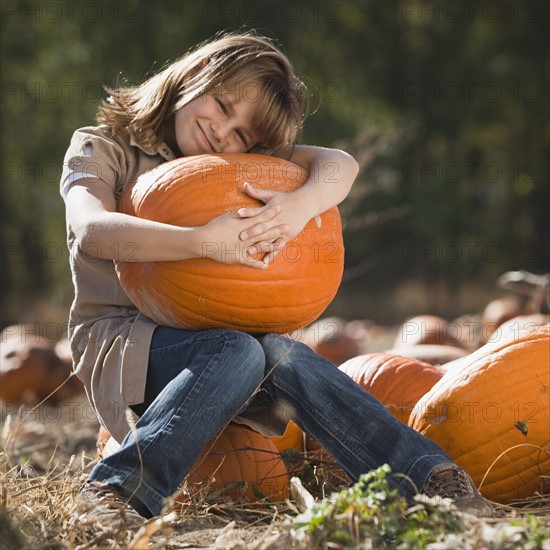 Girl in pumpkin patch. Photographer: Mike Kemp